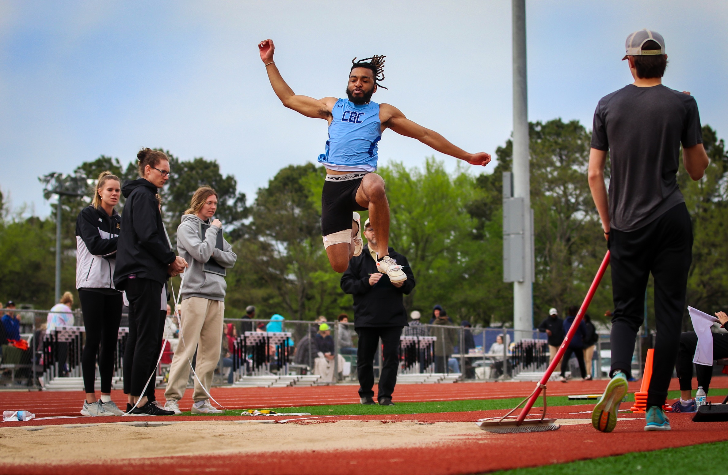 Isaiah Stiget long jumps at Harding Open in 2023